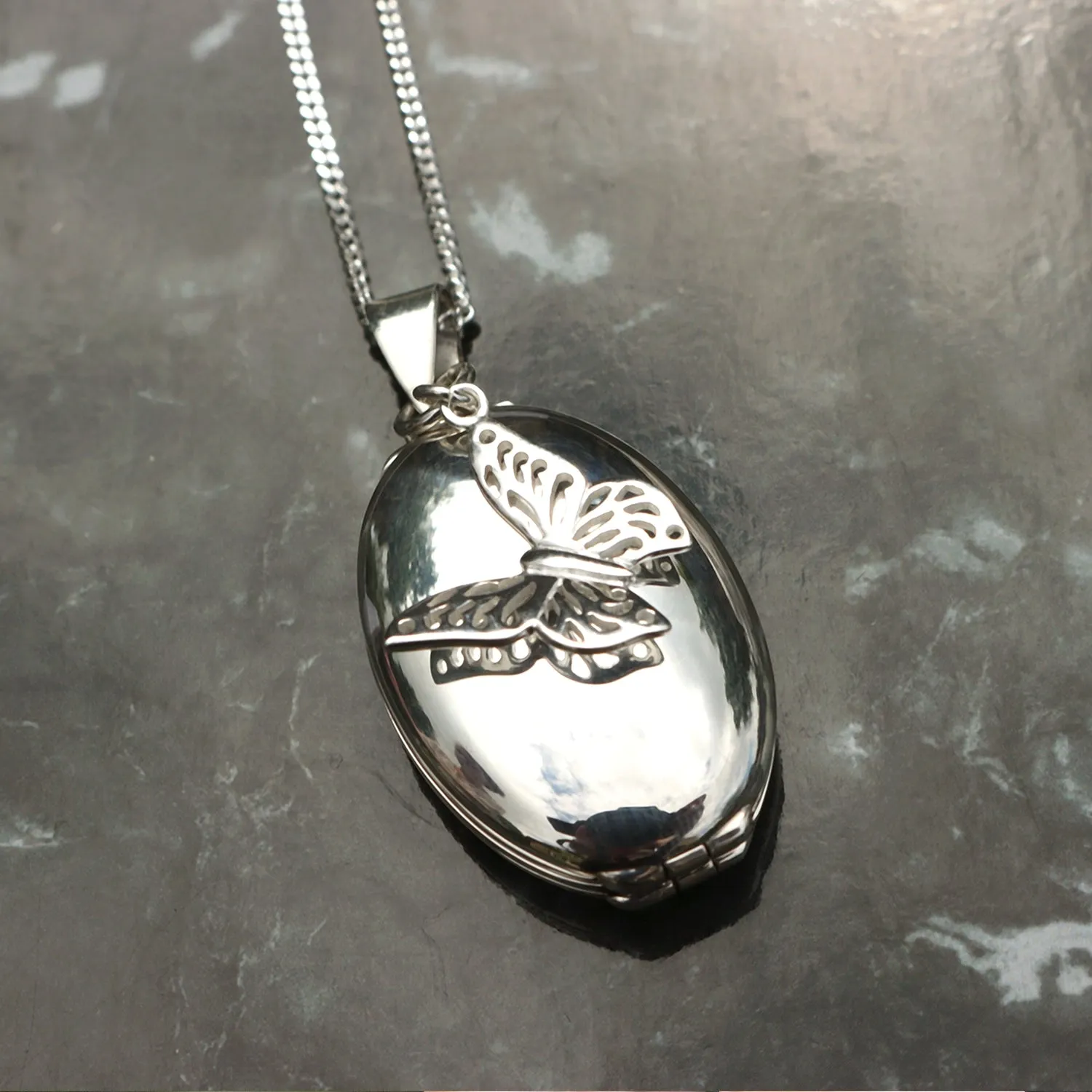 Four Photo Oval Butterfly Locket | Silver