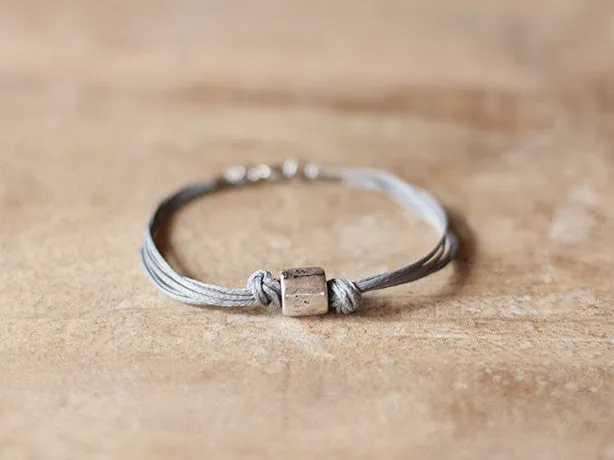 Men's bracelet with a silver tube bead and a gray cord, jewelry for man