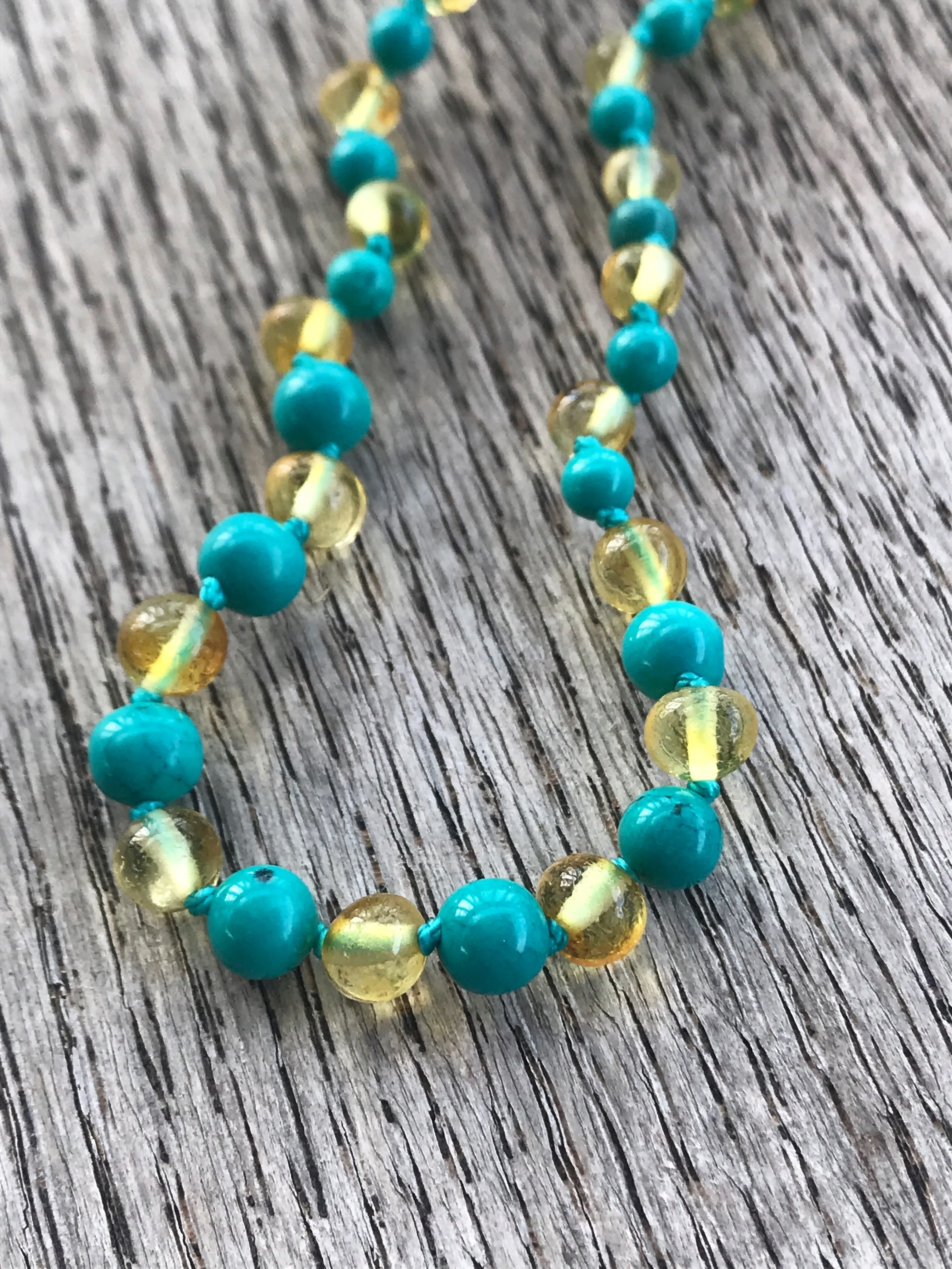Polished Baltic amber and gemstone teething necklace