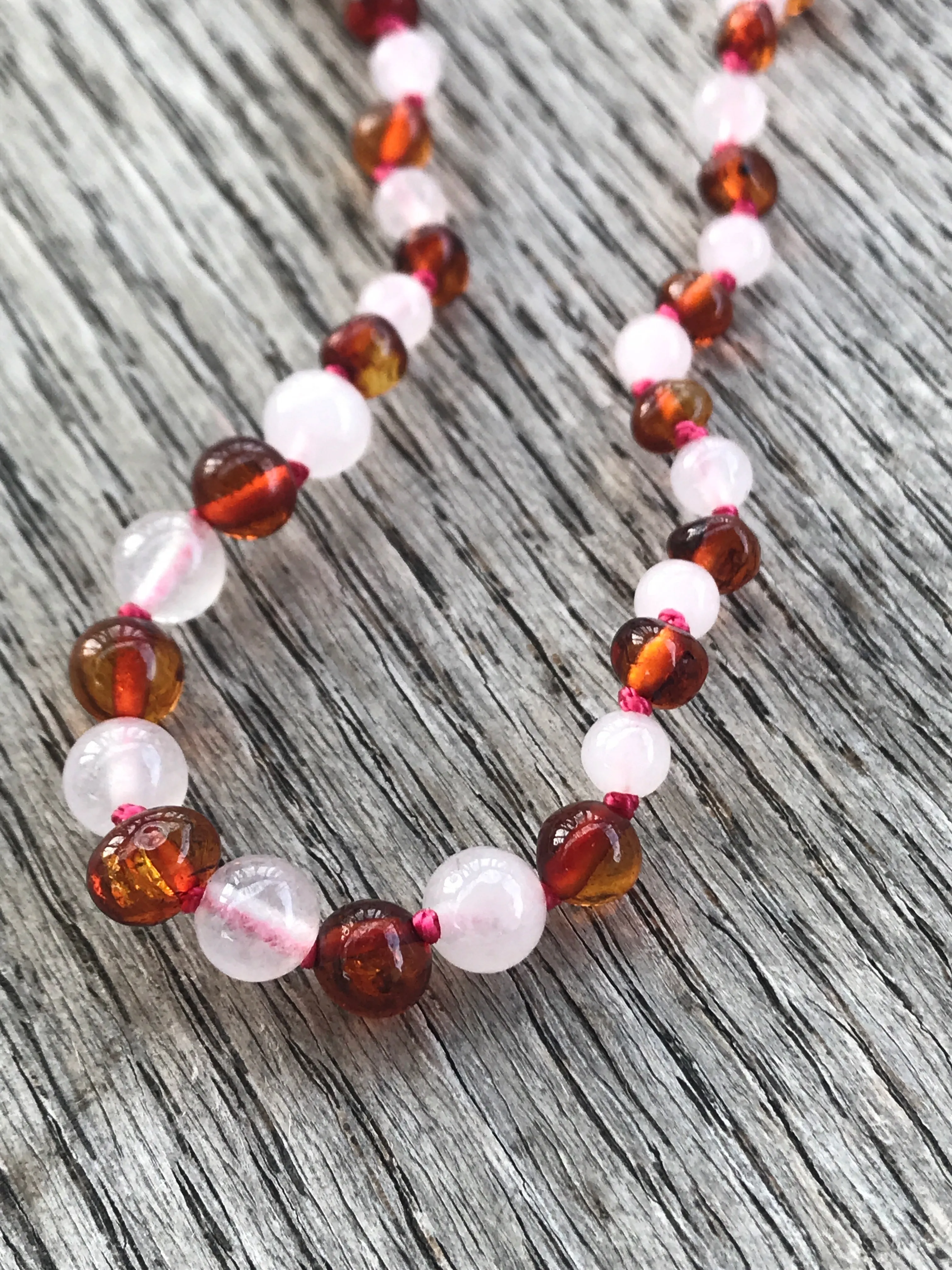 Polished Baltic amber and gemstone teething necklace