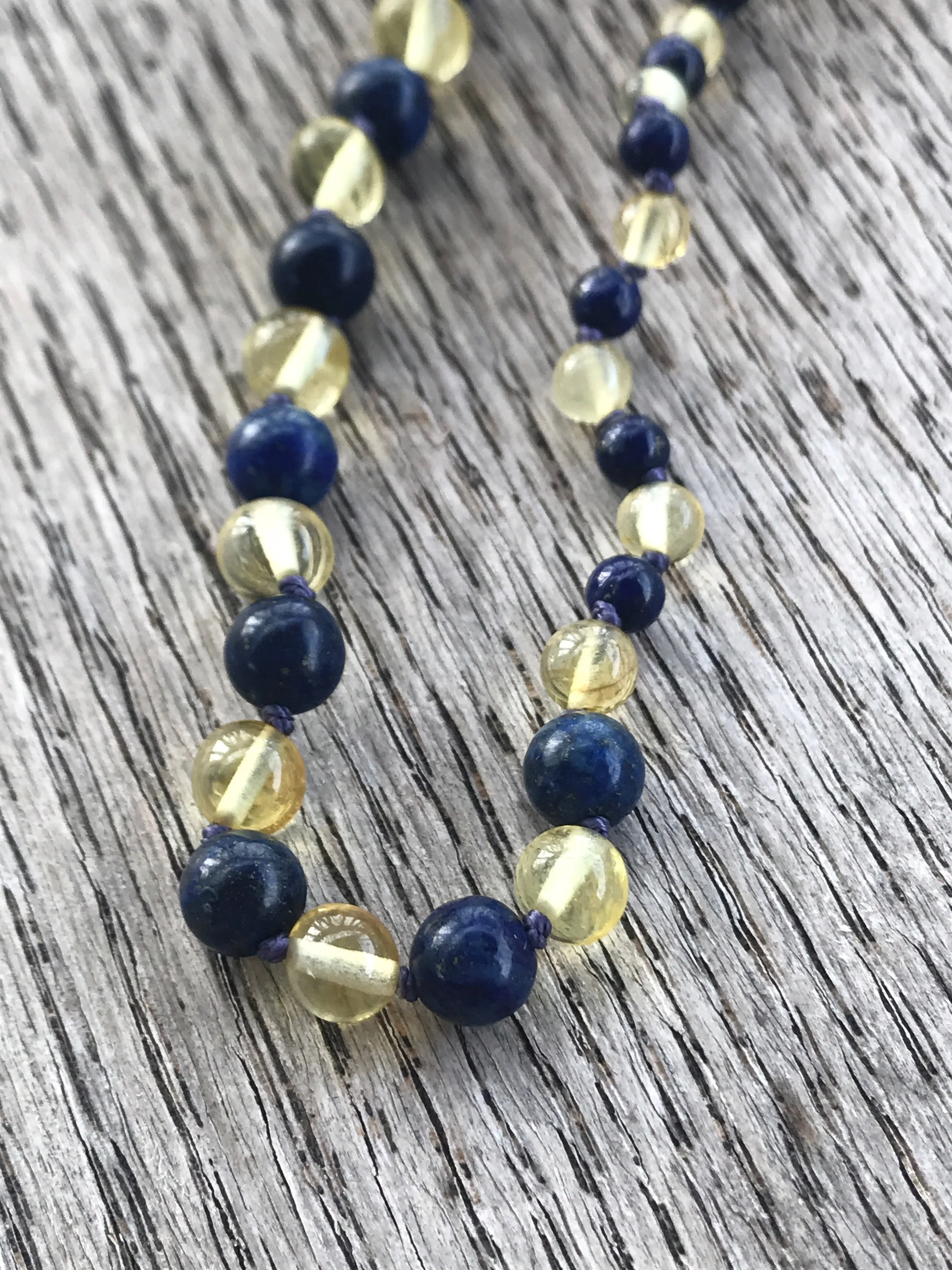Polished Baltic amber and gemstone teething necklace