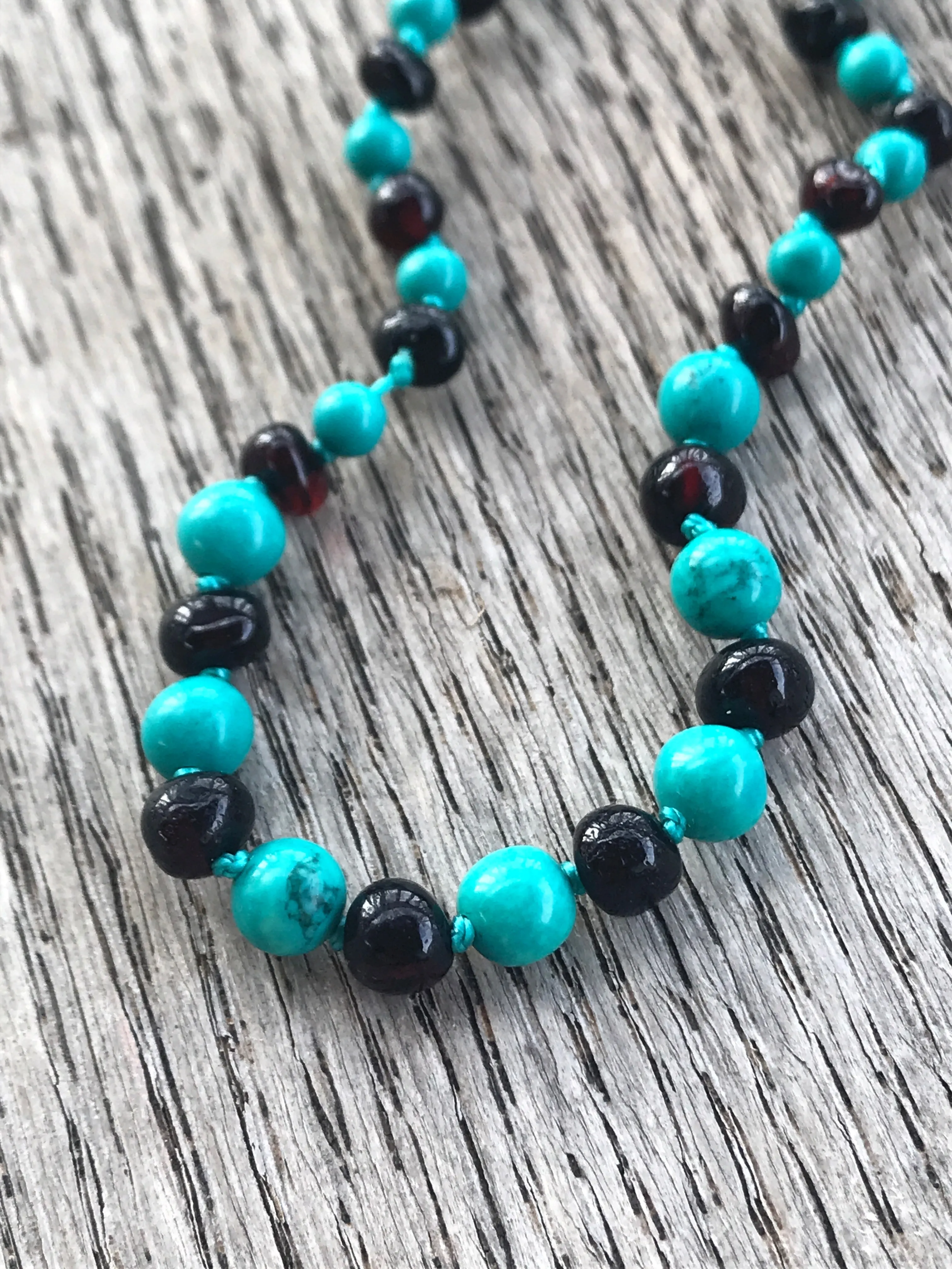 Polished Baltic amber and gemstone teething necklace