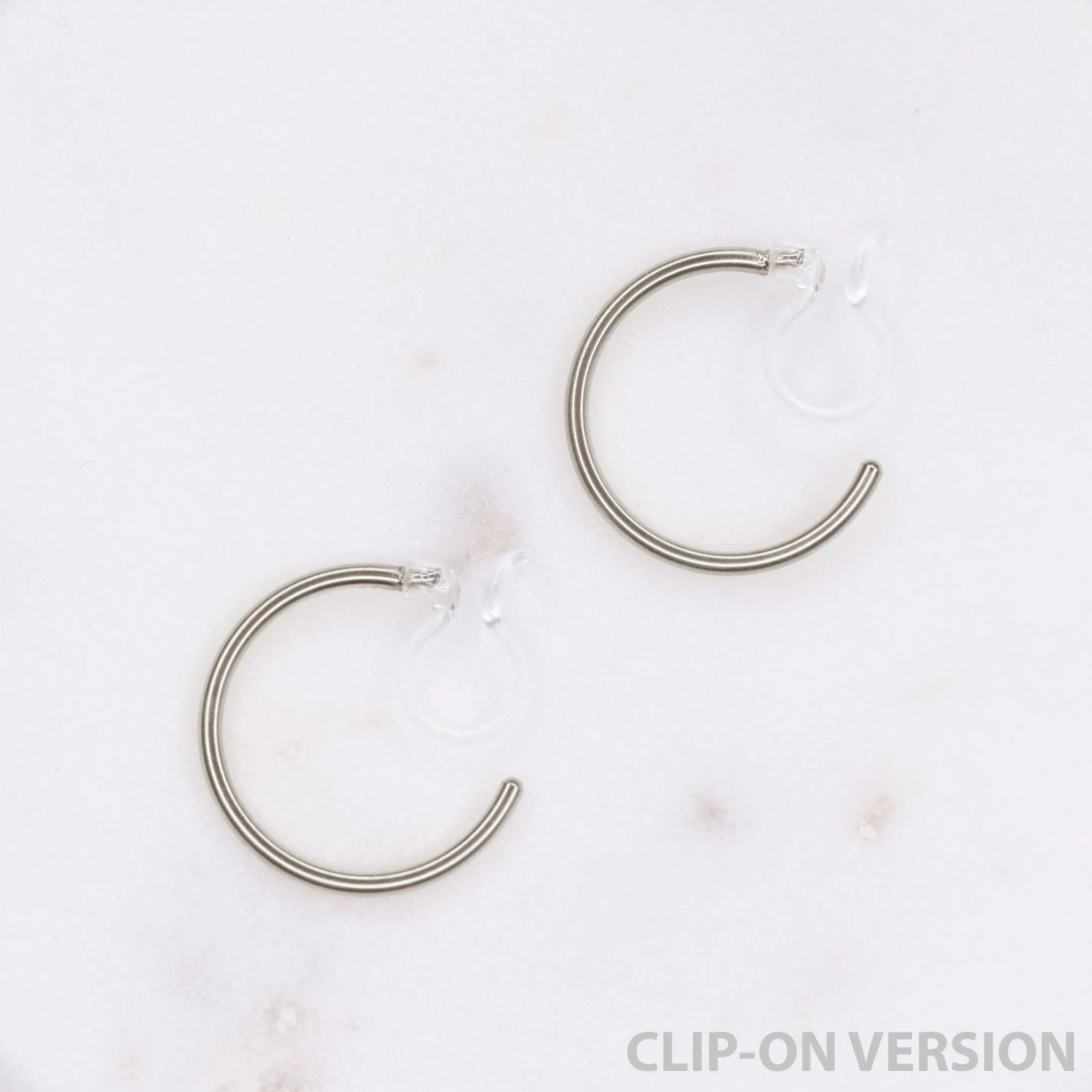 SMALL HOOP CLIP-ON EARRINGS IN SILVER